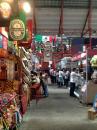 Inside the Mercado: Large building with stalls of eateries and small shops